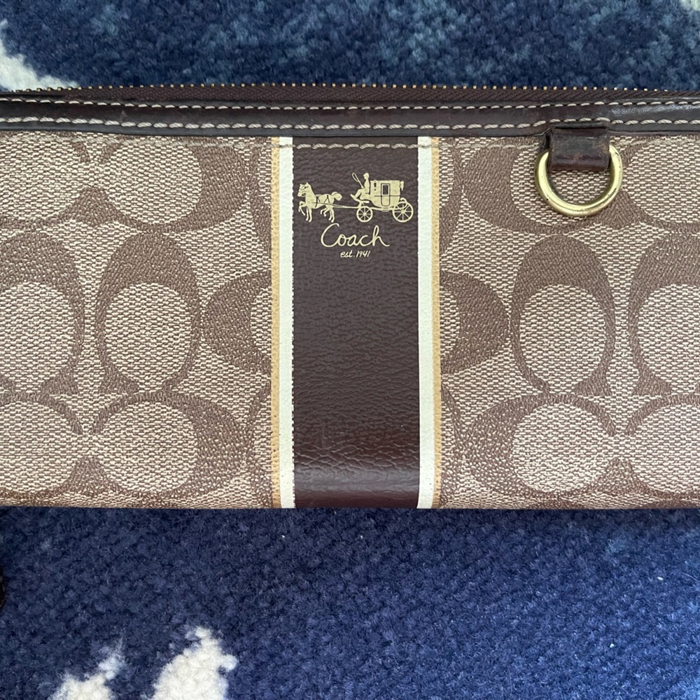 Large Coach brown classic “C” wallet in fairly good condition.